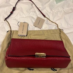 Red Burberry shoulder bag with gold hardware, perfect for an evening dinner!